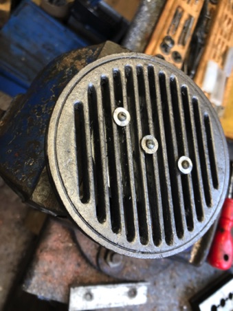 Grate secured to fixture