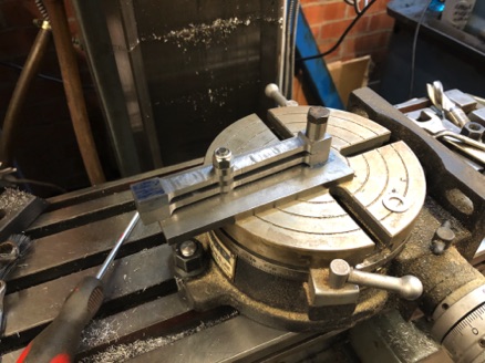 Jig being used to machine the rod