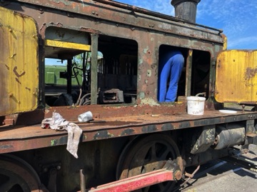 Jim inspects the engine